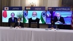 Japanese Prime Minister Yoshihide Suga, Indian Prime Minister Narendra Modi and Australian Prime Minister Scott Morrison listen during a virtual meeting of the "Quad" alliance members: Australia, India, Japan and the US, in the State Dining Room of the White House in Washington. (AFP) Japanese Prime Minister Yoshihide Suga, Indian Prime Minister Narendra Modi and Australian Prime Minister Scott Morrison listen during a virtual meeting of the "Quad" alliance members: Australia, India, Japan and the US, in the State Dining Room of the White House in Washington. (AFP)