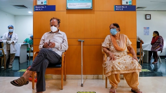 An elderly couple awaits their turn at a vaccination centre in a Delhi private hospital. REUTERS/Adnan Abidi(REUTERS)