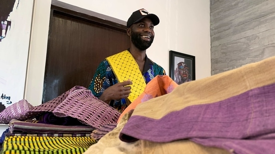 Fashion designer Tsemaye Binitie holds his custom Aso-Oke fabric during a workshop in Lagos, Nigeria February 8, 2021. (REUTERS)