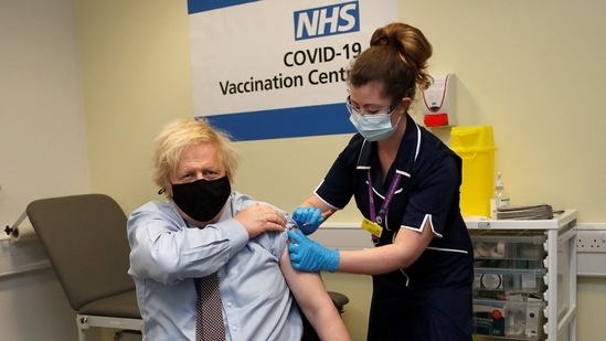 Britain's Prime Minister Boris Johnson receives a dose of a AstraZeneca/Oxford Covid-19 vaccine, administered by nurse and Clinical Pod Lead, Lily Harrington, at the vaccination centre in St Thomas' Hospital in London. (AFP)