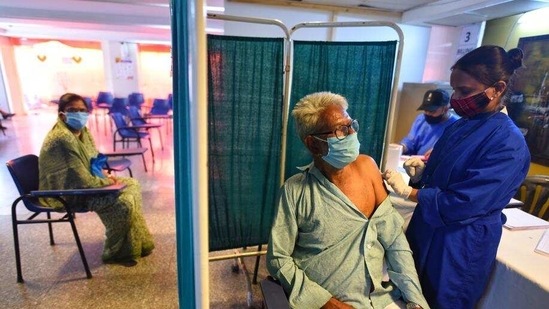 An elderly man gets a Covid vaccine at a city hospital. The city recorded 716 cases on Friday, the maximum this year so far. (Sanchit Khanna/ HT)