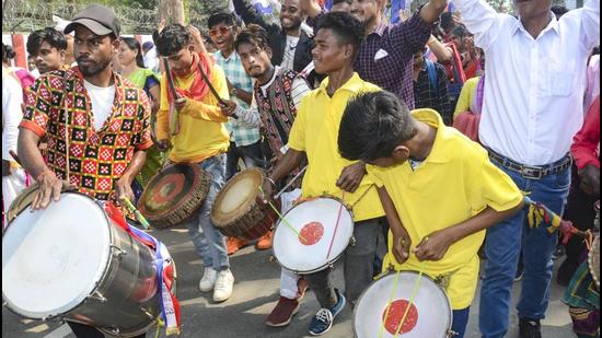 Supporters beat dhol and drums during the nomination filing procession of a candidate in Dibrugarh. (PTI)