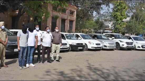 The two accused and the recovered vehicles in police custody on Friday. (HT Photo)