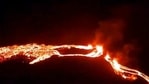This photo provided by the Icelandic Met Office shows an eruption, center right, on the Reykjanes Peninsula in southwestern Iceland on Friday.(AP) This photo provided by the Icelandic Met Office shows an eruption, center right, on the Reykjanes Peninsula in southwestern Iceland on Friday.(AP)
