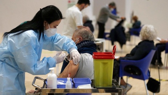 Medical staff members administer the AstraZeneca vaccine at La Nuvola (The Cloud) convention center that was temporarily turned into a Covid-19 vaccination hub, in Rome. (AP Photo ) Medical staff members administer the AstraZeneca vaccine at La Nuvola (The Cloud) convention center that was temporarily turned into a Covid-19 vaccination hub, in Rome. (AP Photo )