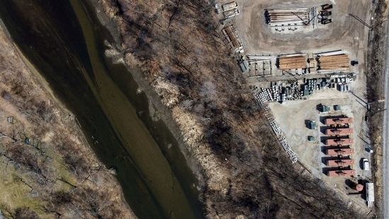An aerial view shows workers collecting plastic trash that litters the polluted Potpecko Lake near a dam's hydroelectric plant close to the town of Priboj, Serbia on January 29. Two barges sailed up and down a vast stretch of floating trash on the Potpecko artificial lake in Serbia, collecting tons of garbage that almost clogged the dam that crosses it.(Marko Djurica / REUTERS)