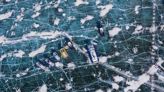 An aerial view shows hover boats on the ice of Lake Baikal near the village of Bolshoye Goloustnoye in the Irkutsk region, Russia on March 8. Lake Baikal remains one of the world's cleanest freshwater reservoirs. But pollution and the growth of weeds are harming microorganisms, sponges and some molluscs that filter its waters.(Maxim Shemetov / REUTERS)
