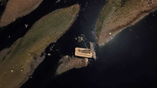 An aerial view shows a discarded sofa on the Tiete river near Ecological Tiete Park in Sao Paulo, Brazil, on March 17. The Rio Tiete, which flows like a vast open sewer through Brazil's largest city Sao Paulo, is among the most polluted in the country. Over 100 km of the river are considered dead or too polluted for almost all marine life, Reuters reported.(Amanda Perobelli / REUTERS)