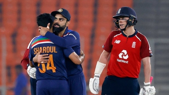 India's Virat Kohli celebrates winning the match with Shardul Thakur as England's Sam Curran looks on  (REUTERS)