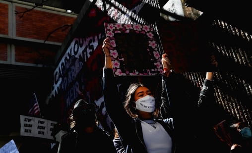 People hold placards during a "Stop Asian Hate" rally, following the deadly shootings, in Atlanta, Georgia, US. (REUTERS) People hold placards during a "Stop Asian Hate" rally, following the deadly shootings, in Atlanta, Georgia, US. (REUTERS)