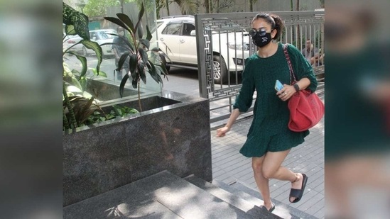She completed her outfit with a large red tote bag, a pair of basic black slides and reflector sunnies. Which type of dress is more your style?(Varinder Chawla)