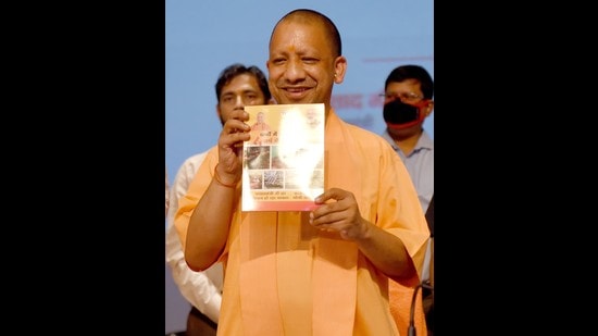 Uttar Pradesh chief minister Yogi Adityanath releasing a booklet on the completion of four years of his government, in Lucknow on Friday. (Deepak Gupta/HT Photo)