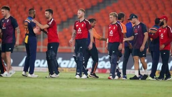 England and Indian players shake hands with each other after Indian won the fourth Twenty20 cricket match between India and England at Narendra Modi Stadium in Ahmedabad, India, Thursday, March 18, 2021. (AP) England and Indian players shake hands with each other after Indian won the fourth Twenty20 cricket match between India and England at Narendra Modi Stadium in Ahmedabad, India, Thursday, March 18, 2021. (AP)