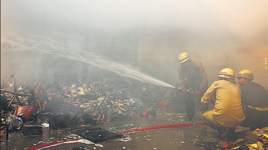Firefighters trying to control the blaze at Rajnish Industries at Focal Point, Phase 4, in Ludhiana on Saturday. (Gurpreet Singh/HT)
