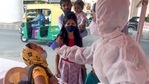 A medic collects a swab sample of woman for the Covid-19 test amid the rise in cases, in New Delhi on Sunday.(ANI Photo) A medic collects a swab sample of woman for the Covid-19 test amid the rise in cases, in New Delhi on Sunday.(ANI Photo)