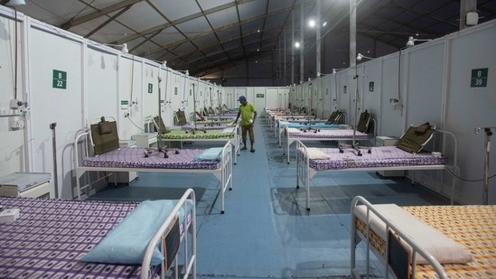 A jumbo covid care centre being set up at COEP ground in Pune, on March 19. Witnessing a surge in the last 10 days, India's death toll rose to 159,755 after 197 new fatalities were reported on March 21.(Pratham Gokhale / HT Photo)