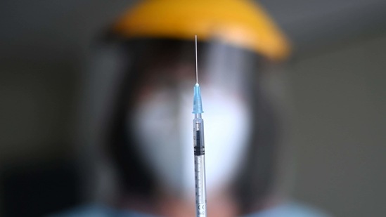 A medical assistant shows a syringe with the Pfizer-BioNTech Covid-19 vaccine for residents and staff at a nursing home for seniors in Froendenberg, western Germany. (AFP) A medical assistant shows a syringe with the Pfizer-BioNTech Covid-19 vaccine for residents and staff at a nursing home for seniors in Froendenberg, western Germany. (AFP)