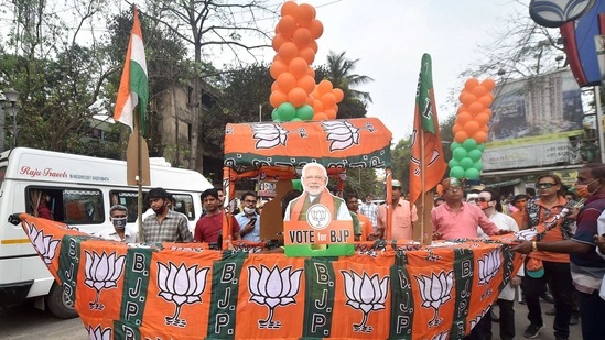 Kolkata: BJP supporters of BJP candidate from Tollygunge constituency Babul Supriyo during his election campaign ahead of state assembly polls, in Kolkata, Monday, March 19, 2021. (PTI Photo/Swapan Mahapatra)(PTI03_19_2021_000219A)(PTI)