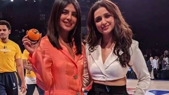 Parineeti Chopra and Priyanka Chopra pose together. 