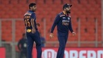 India's Bhuvneshwar Kumar, left, watches as captain Virat Kohli, right, reacts after the dismissal of England's Jos Buttler during the fifth Twenty20 cricket match between India and England at Narendra Modi Stadium in Ahmedabad.(AP) India's Bhuvneshwar Kumar, left, watches as captain Virat Kohli, right, reacts after the dismissal of England's Jos Buttler during the fifth Twenty20 cricket match between India and England at Narendra Modi Stadium in Ahmedabad.(AP)