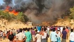 Rohingya refugees watch smoke rising following a fire at the Rohingya refugee camp in Balukhali, southern Bangladesh, Monday, March 22, 2021. The fire destroyed hundreds of shelters and left thousands homeless, officials and witnesses said. (AP Photo/ Shafiqur Rahman)(AP) Rohingya refugees watch smoke rising following a fire at the Rohingya refugee camp in Balukhali, southern Bangladesh, Monday, March 22, 2021. The fire destroyed hundreds of shelters and left thousands homeless, officials and witnesses said. (AP Photo/ Shafiqur Rahman)(AP)