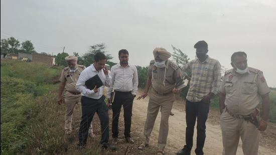 A team from the Forensics Science Laboratory at the encounter spot in Tarn Taran on Monday. (HT Photo) A team from the Forensics Science Laboratory at the encounter spot in Tarn Taran on Monday. (HT Photo)