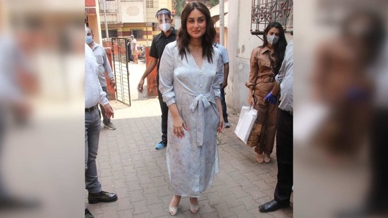 She had teamed the button-down number with a pair of grey peep-toe heels and accessorised the look with a delicate gold necklace.(Varinder Chawla)