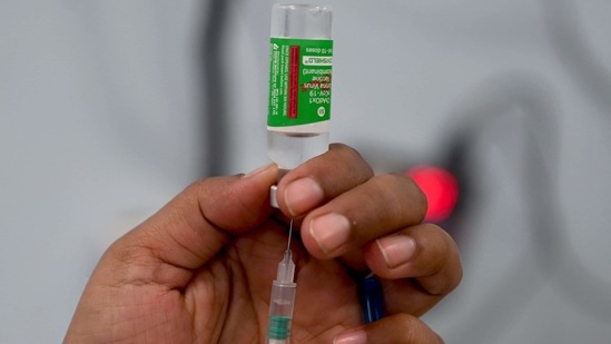 A medical staff fills a syringe with the Covishield vaccine before inoculating a beneficiary at a hospital in Mumbai on March 17.(AFP File Photo)