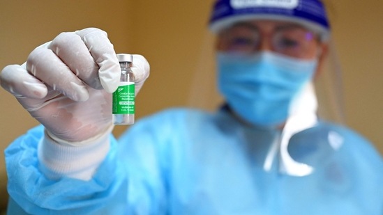 A medical worker shows a vial of the AstraZeneca vaccine against the Covid-19 coronavirus.(AFP)