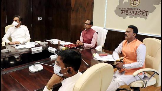 Madhya Pradesh CM Shivraj Singh chouhan and Cabinet minister Tulsi Silawat at the signing of the Ken-Betwa Link Project, in Bhopal on Monday, March 22. (ANI) Madhya Pradesh CM Shivraj Singh chouhan and Cabinet minister Tulsi Silawat at the signing of the Ken-Betwa Link Project, in Bhopal on Monday, March 22. (ANI)