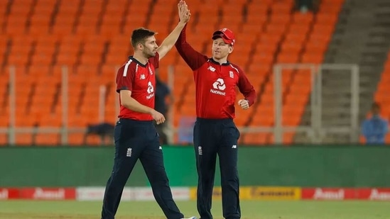 Eoin Morgan celebrates a wicket with Mark Wood. (BCCI)