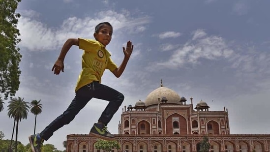 A child enjoys the pleasant weather at Humayun Tomb in New Delhi. Temperature is expected to remain on the lower side for the next few days. (Ravi Choudhary/HT PHOTO) A child enjoys the pleasant weather at Humayun Tomb in New Delhi. Temperature is expected to remain on the lower side for the next few days. (Ravi Choudhary/HT PHOTO)