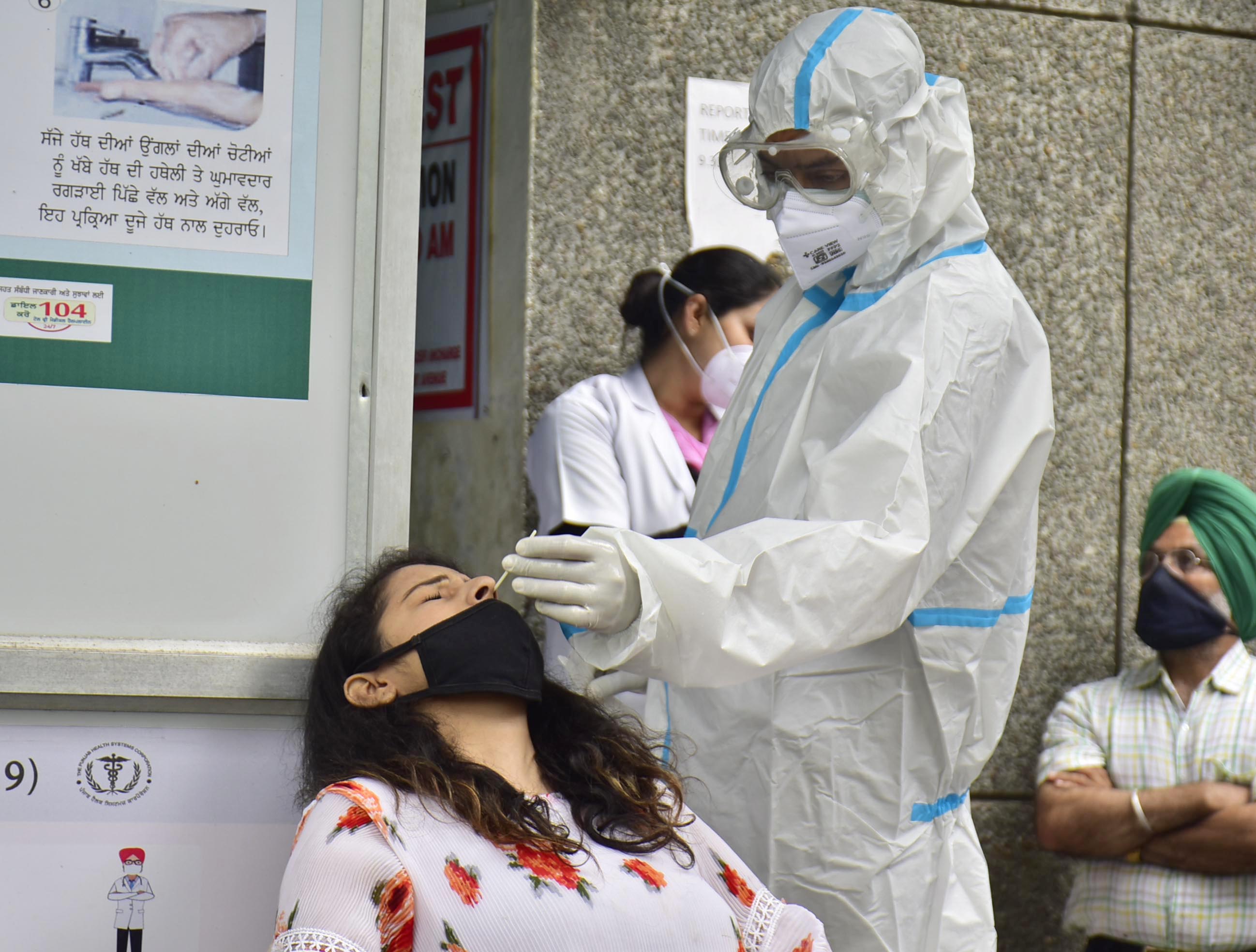 A health worker collects swab samples for Covid-19 testing in Amritsar on Monday. (Sameer Sehgal/HT) A health worker collects swab samples for Covid-19 testing in Amritsar on Monday. (Sameer Sehgal/HT)