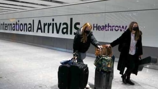 Travelers arrive at Heathrow Airport in London.(AP)