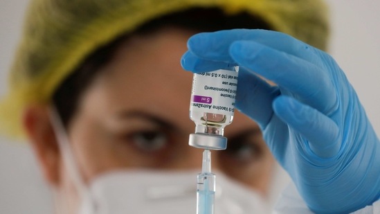 A healthcare worker prepares a dose of the AstraZeneca vaccine against Covid-19 during a vaccination rollout in Ronda, Spain.(REUTERS)