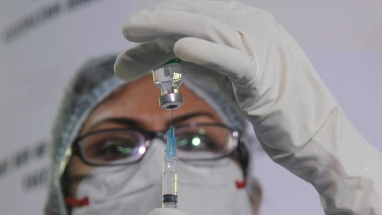 A nurse fills Covidshield dose in injection before administrating after the launch of the Covid-19 vaccination drive. (ANI File Photo)