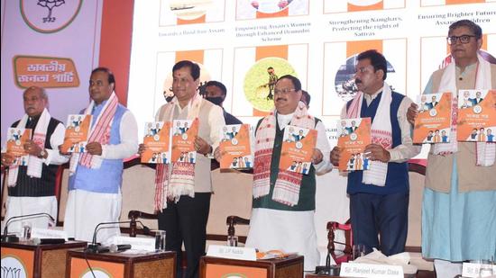 BJP president J P Nadda with Assam chief minister Sarbananda Sonowal releases the party's election manifesto for assembly polls, in Guwahati on Tuesday, March 23. (PTI)