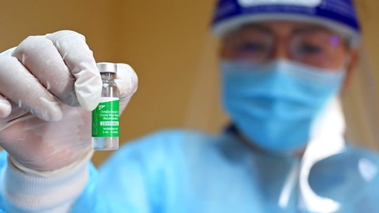 A medical worker shows a vial of the AstraZeneca vaccine against the Covid-19 coronavirus. (AFP)