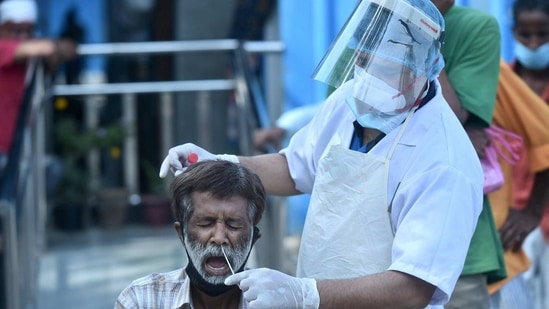 New Delhi: A health worker collects swab sample from a person for COVID-19 test, near Kashmere Gate in New Delhi, Saturday, March 20, 2021. (PTI Photo/Arun Sharma) (PTI03_20_2021_000166B) (PTI) New Delhi: A health worker collects swab sample from a person for COVID-19 test, near Kashmere Gate in New Delhi, Saturday, March 20, 2021. (PTI Photo/Arun Sharma) (PTI03_20_2021_000166B) (PTI)