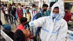 A healthcare worker takes a swab sample of a passenger for Covid-19 test at Chhatrapati Shivaji Maharaj Terminus, in Mumbai earlier this month. (File photo) A healthcare worker takes a swab sample of a passenger for Covid-19 test at Chhatrapati Shivaji Maharaj Terminus, in Mumbai earlier this month. (File photo)