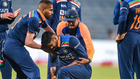 Pune: Indian cricketer Shreyas Iyer being attended by teammates during the first One Day International cricket match between India and England at Maharashtra Cricket Association Stadium, in Pune, Tuesday, March 23, 2021. (PTI Photo/Kunal Patil)(PTI03_23_2021_000303B)(PTI)