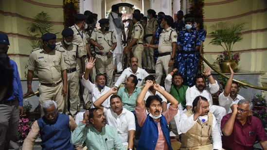 Grand Alliance legislators stage a dharna in the main entrance of Bihar Assembly during Budget session, in Patna.(PTI)