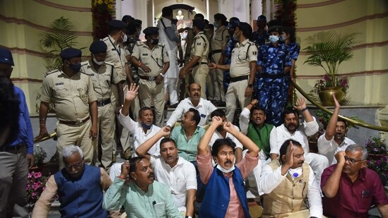 Patna: Grand Alliance legislators stage a dharna in the main entrance of Bihar Assembly during Budget session, in Patna, Tuesday, March 23, 2021. (PTI)