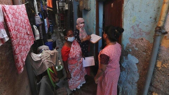 Health workers screen people for tuberculosis in Dharavi, Mumbai. (AP)