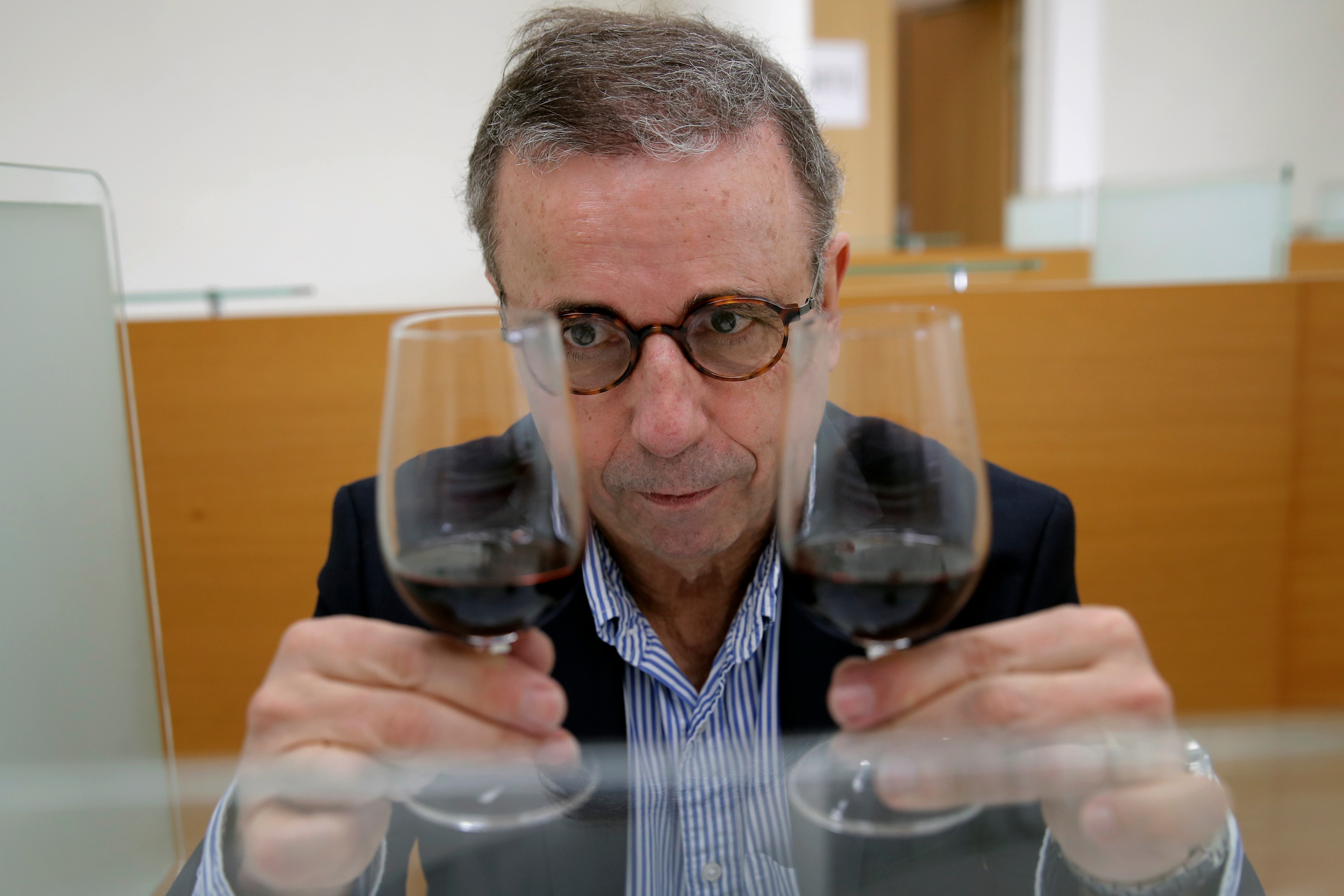 Bordeaux Mayor Pierre Hurmic checks glasses of wine, during a tasting session, with one glass containing wine that spent a year orbiting the world in the International Space Station, at the Institute for Wine and Vine Research in Villenave-d'Ornon, southwestern France.(AP) Bordeaux Mayor Pierre Hurmic checks glasses of wine, during a tasting session, with one glass containing wine that spent a year orbiting the world in the International Space Station, at the Institute for Wine and Vine Research in Villenave-d'Ornon, southwestern France.(AP)
