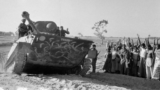 East Pakistani villagers cheer at an advancing Indian army tank, as it moves towards Bogra, East Pakistan, on December 14, 1971. It was 50 years ago on the night of March 25, 1971, that Pakistan's military launched a violent crackdown on the city of Dhaka, then part of East Pakistan, to quell a rising nationalist movement seeking independence for what is today known as Bangladesh.(AP)