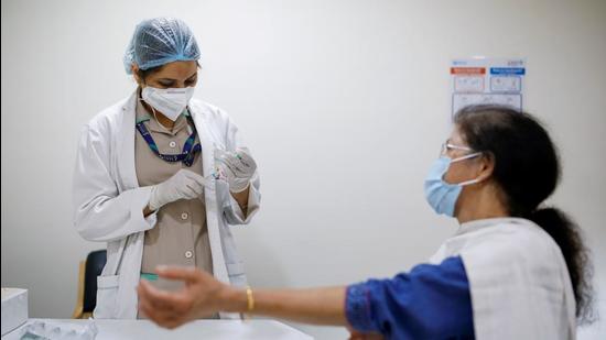 A woman watches as a healthcare worker fills a syringe with a dose of Covishield vaccine manufactured by the Serum Institute of India, at Max Super Speciality Hospital, in New Delhi, India. (REUTERS) A woman watches as a healthcare worker fills a syringe with a dose of Covishield vaccine manufactured by the Serum Institute of India, at Max Super Speciality Hospital, in New Delhi, India. (REUTERS)