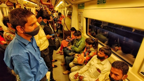 Heavy rush of commuters seen inside a Delhi Metro coach in clear violation of Covid-19 protocol, at Rajiv Chowk, in New Delhi, India, on Thursday, March 25, 2021. (Photo by Sanchit Khanna / Hindustan Times)