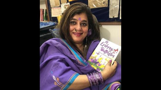 Award-winning author Preeti Singh with her book, ‘Of Epilepsy Butterflies: Flying Beyond Stigmas’. (HT PHOTO)
