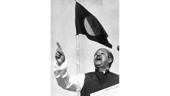 East Pakistan's Awami League party leader Sheikh Mujibur Rahman, addresses a mass gathering beneath the flag proposed for a new country, on March 7, 1971. At the time this photo was taken, the government in the Bengali speaking Eastern province of Pakistan was running on an informal basis under Rahman's leadership.(AP)